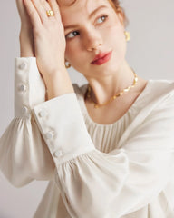 プリーツラウンドネックシルクブラウス